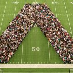 The freshman class posing for a picture in the shape of a W